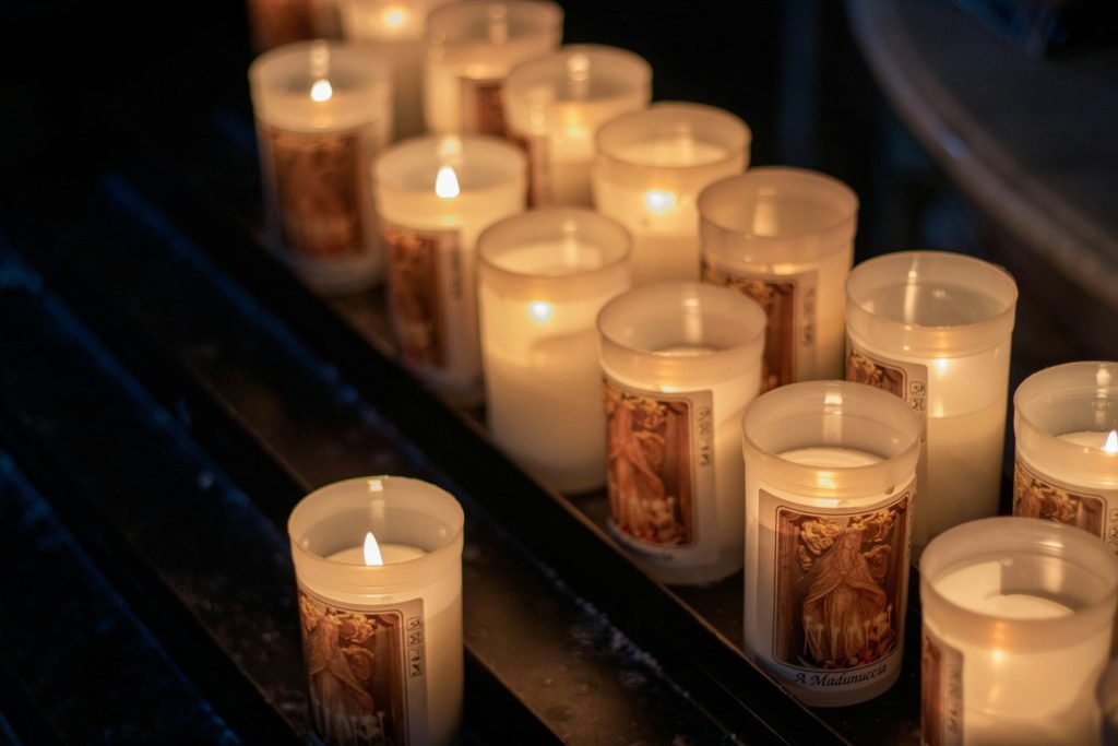 Rows of lit candles